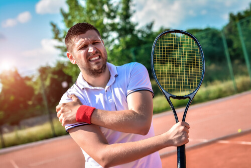3 potential causes of shoulder pain when moving your arm across your body