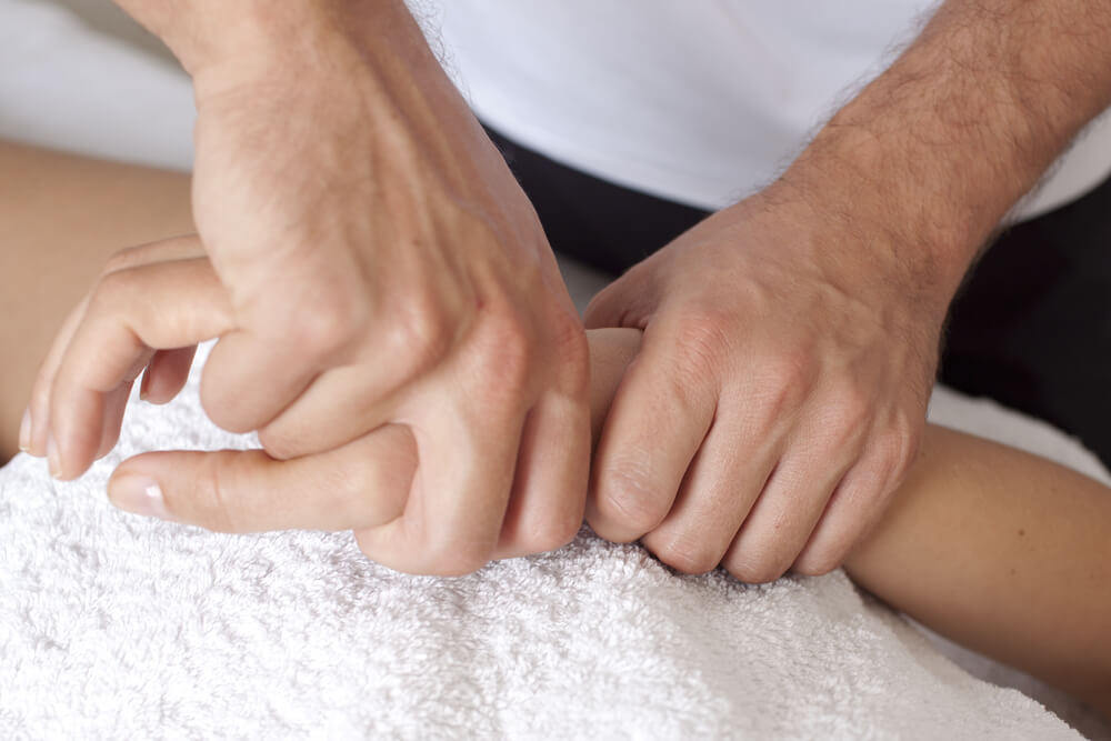 Pain in back of the hand: Causes and treatments