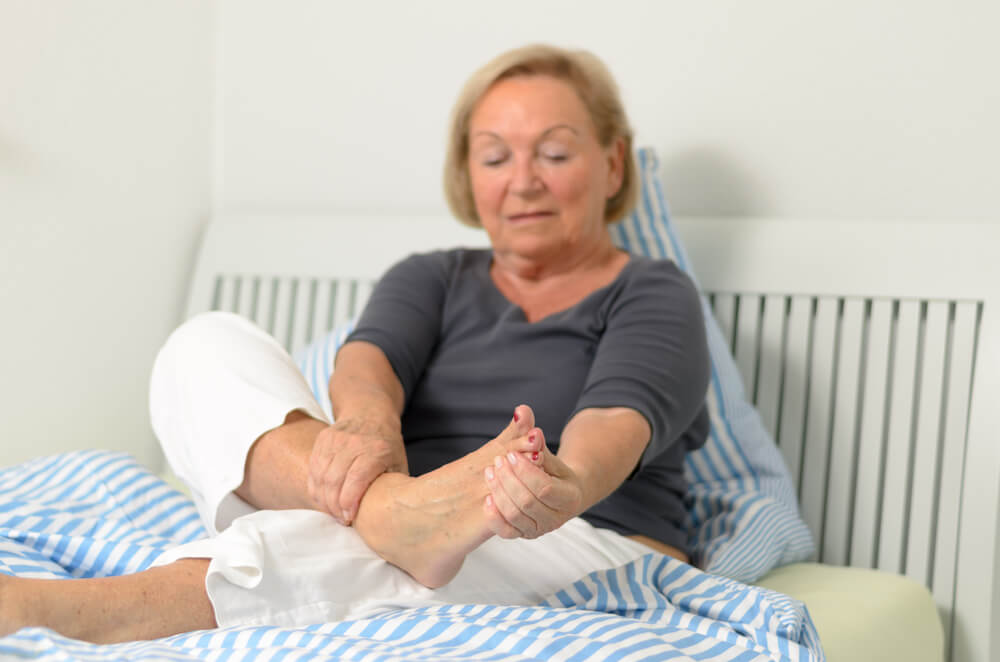 What causes a stabbing pain in the side of my foot?