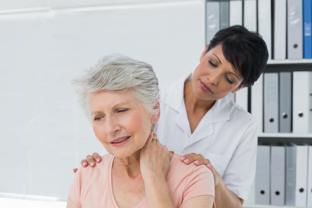 What causes herniated discs that trigger neck pain?