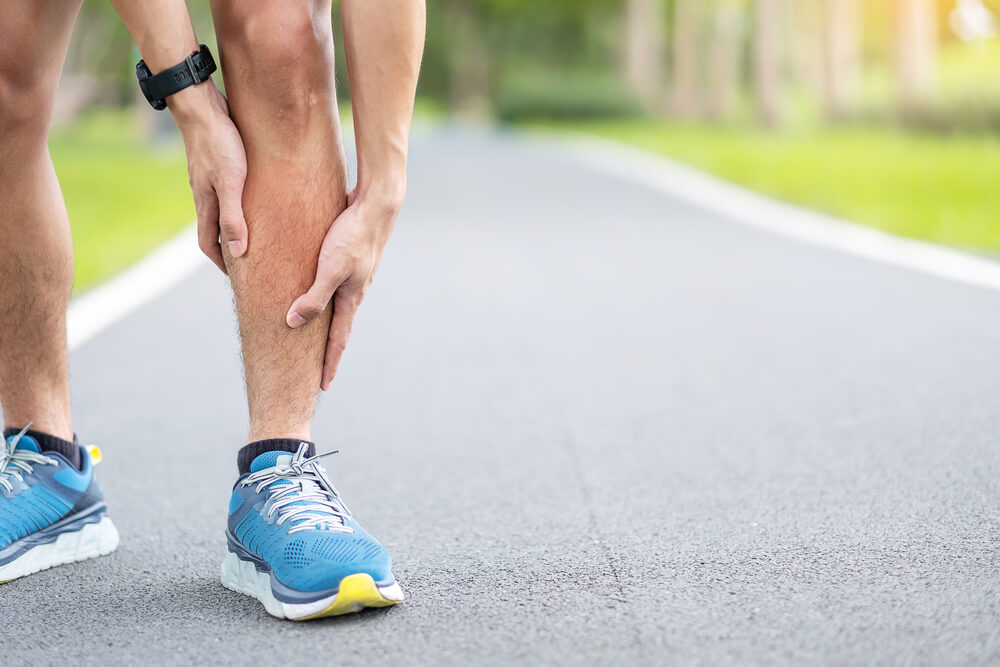 Why do I feel pain in my lower leg above the ankle when running?