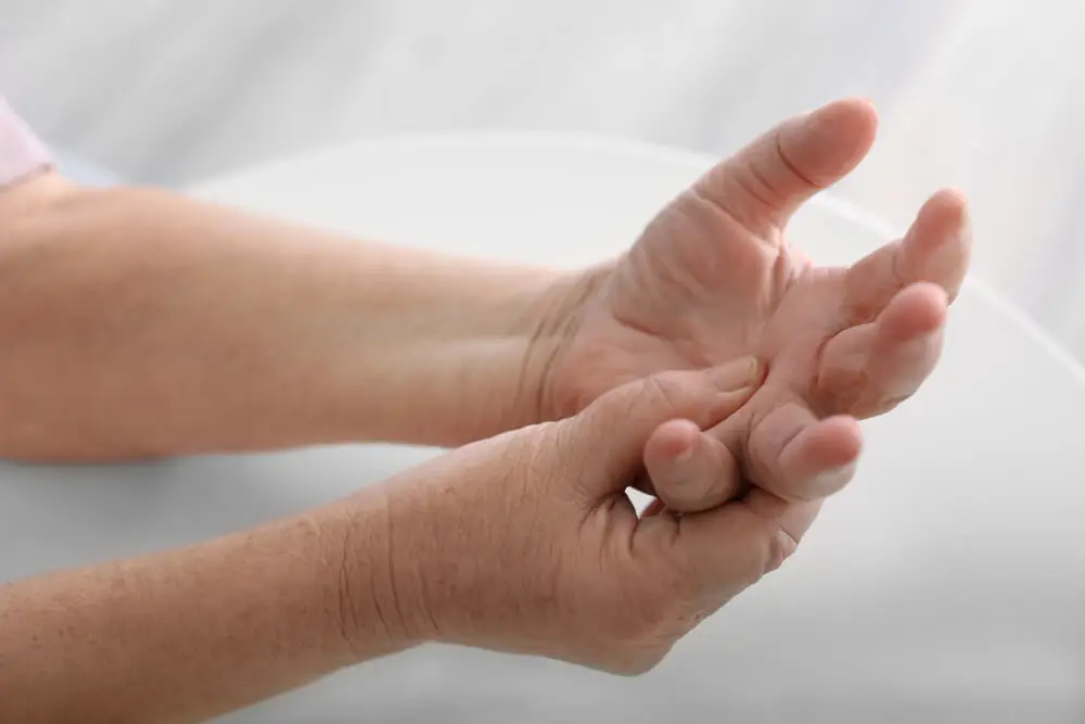 Who is likely to feel pain on the pinky side of their hand?