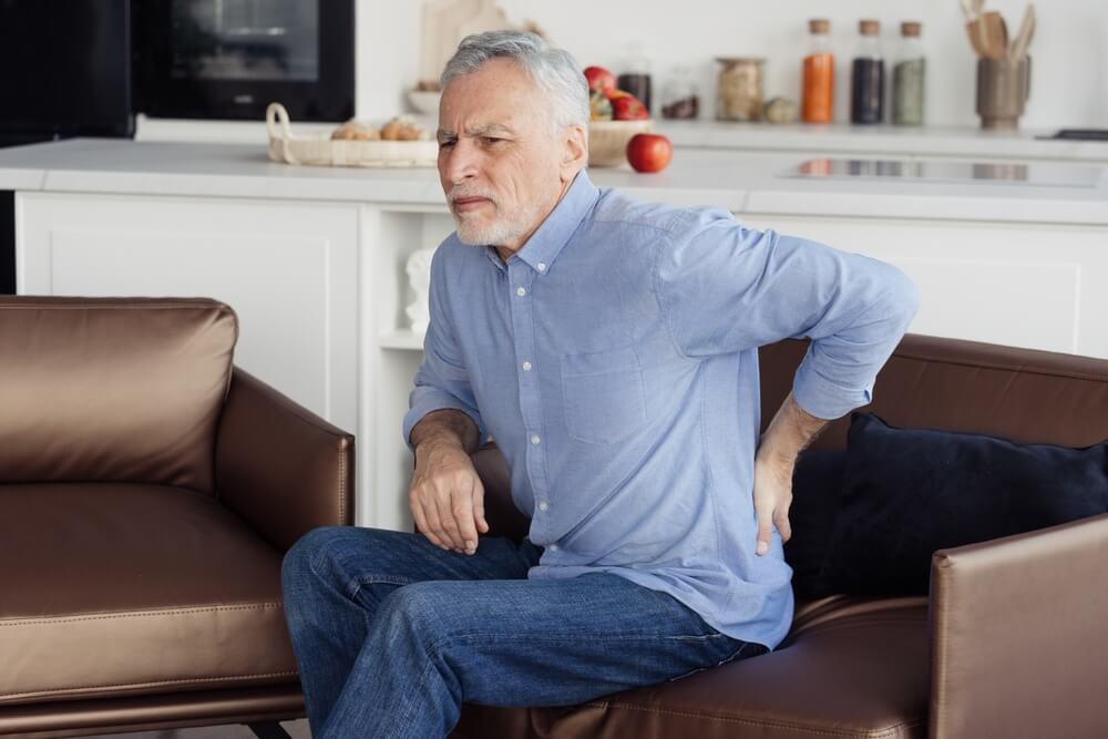Why do I have tailbone pain when I get up and sit down?