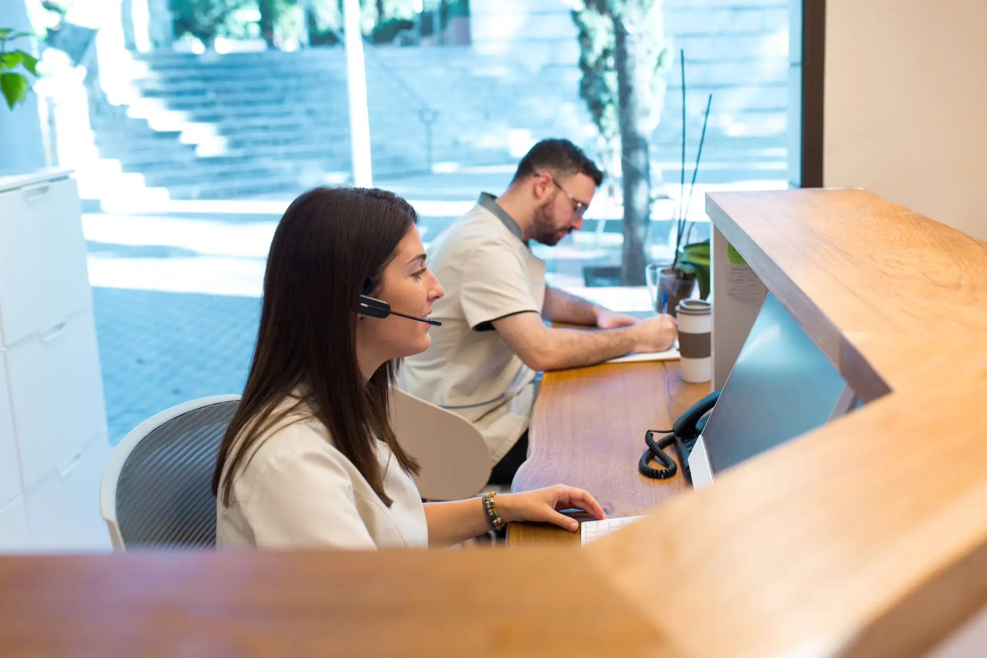 3 strategies for growing your physical therapy business receptionist taking calls at physical therapy cent 2022 06 07 20 09 31 utc scaled 3 strategies for growing your physical therapy business